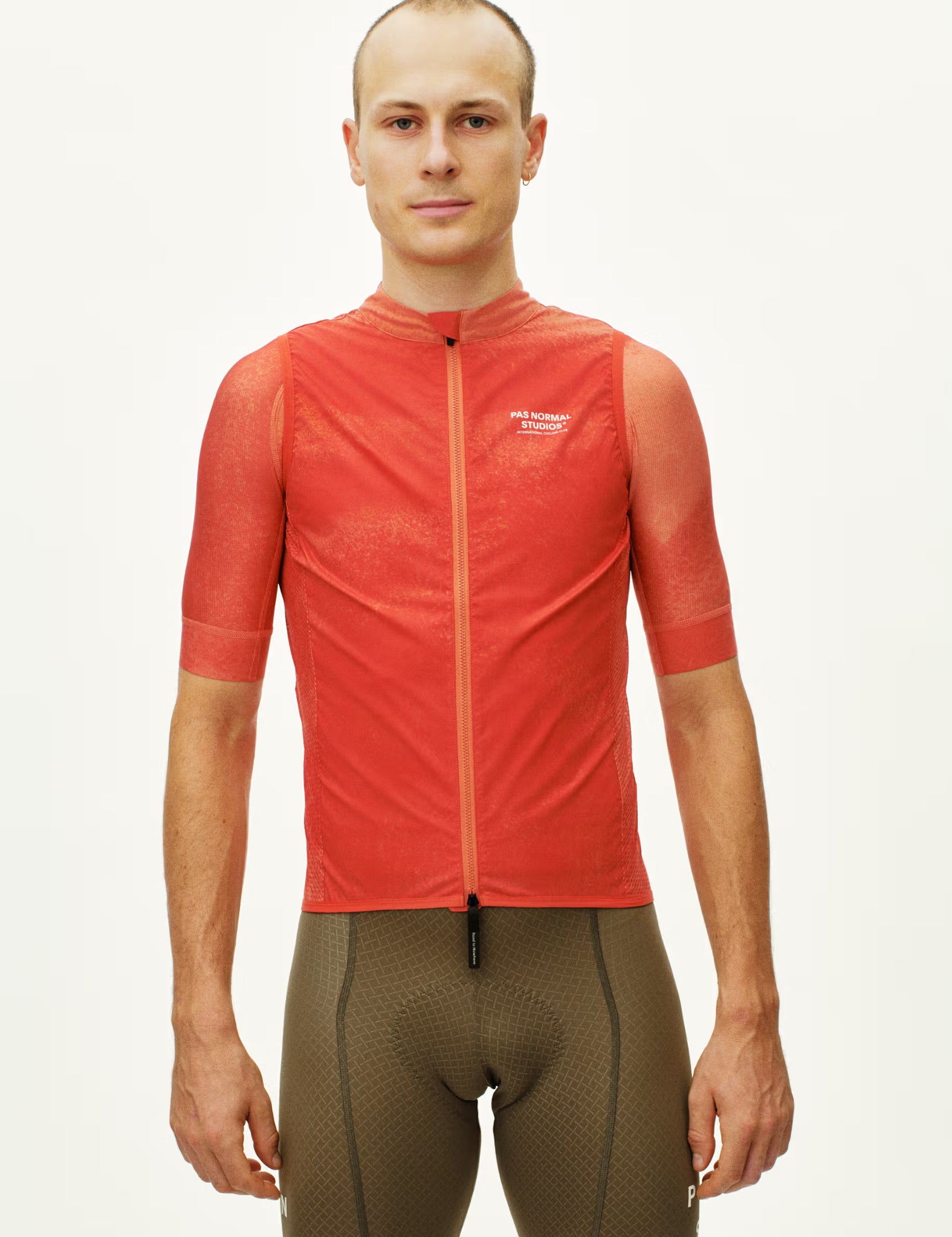 Pas Normal Studios Mechanism Gilet - AOP Hibiscus Orange | Benchmark.